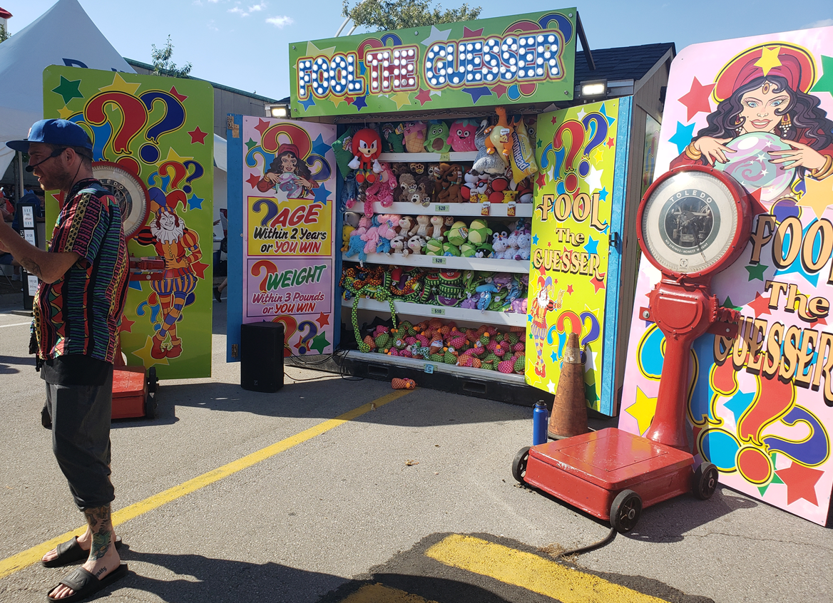 Guess your weight or age booth at the CNE.